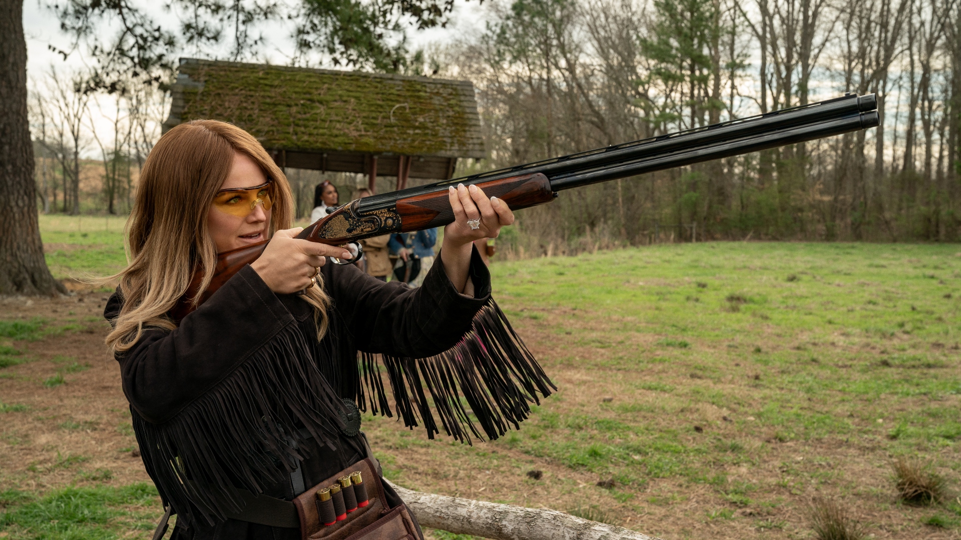 Margo holds a gun in The Hunting Wives