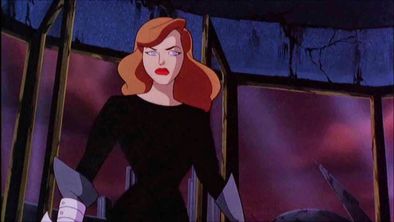 Andrea Beaumont stands with an annoyed look on her face in Batman: Mask of the Phantasm