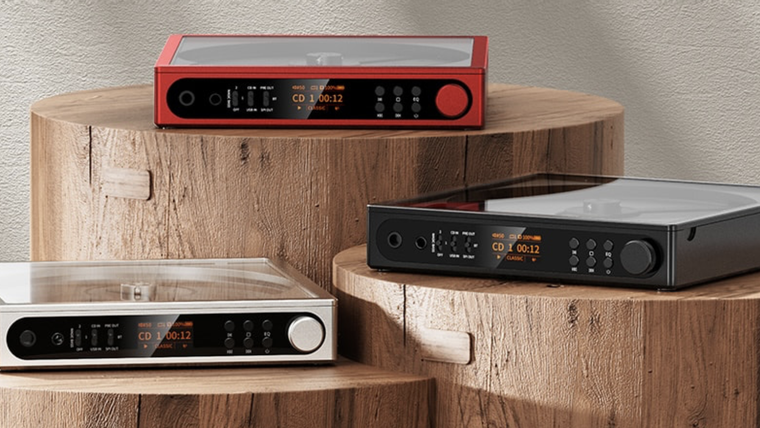 FiiO DM15 R2R players in red, silver and grey, on wooden tables