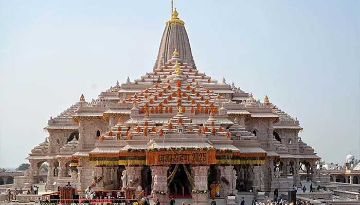 This handout photo taken and released by the Indian Press Information Bureau on Nov. 25 shows Indian Prime Minister Narendra Modi (C) taking part in a flag-raising ceremony to mark the completion of the Ram Temple's construction in Ayodhya, India. - Reuters