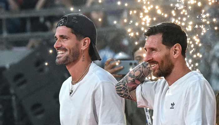 Argentina soccer players Lionel Messi (right) and Rodrigo De Paul arrive to attend an event during Messi's GOAT Tour at the Wankhede Stadium in Mumbai on December 14, 2025.— AFP