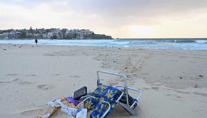 Items lie on the sand after the attack on a Jewish holiday at Sydney's Bondi Beach in Sydney, Australia on December 15, 2025. — Reuters