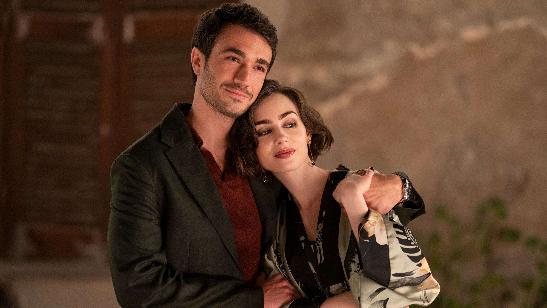 Marcello puts an arm around Emily