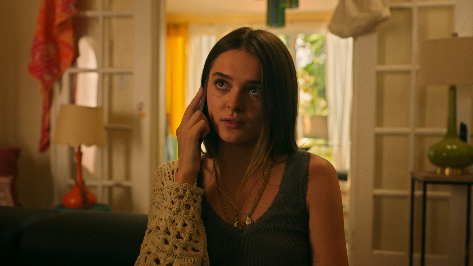 Caitlin talking on the phone in Bad Monkey