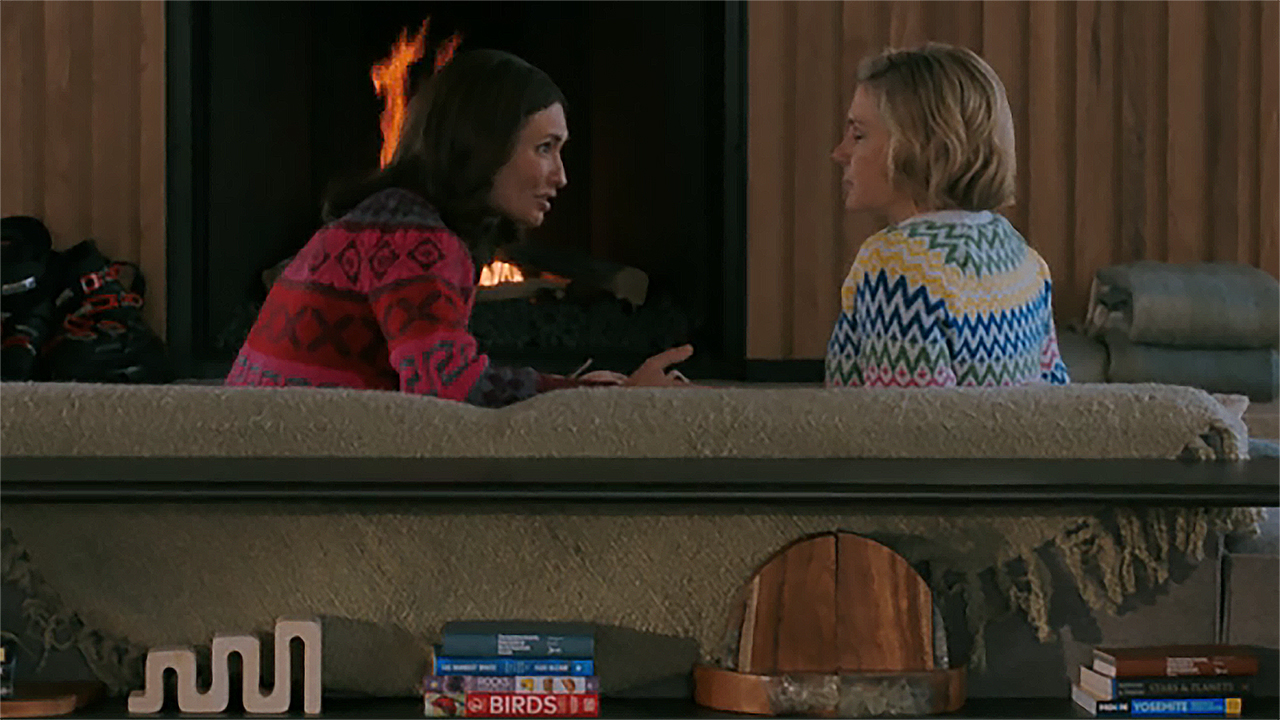 Zosia and Carol talk while sitting on a couch in Pluribus episode 9