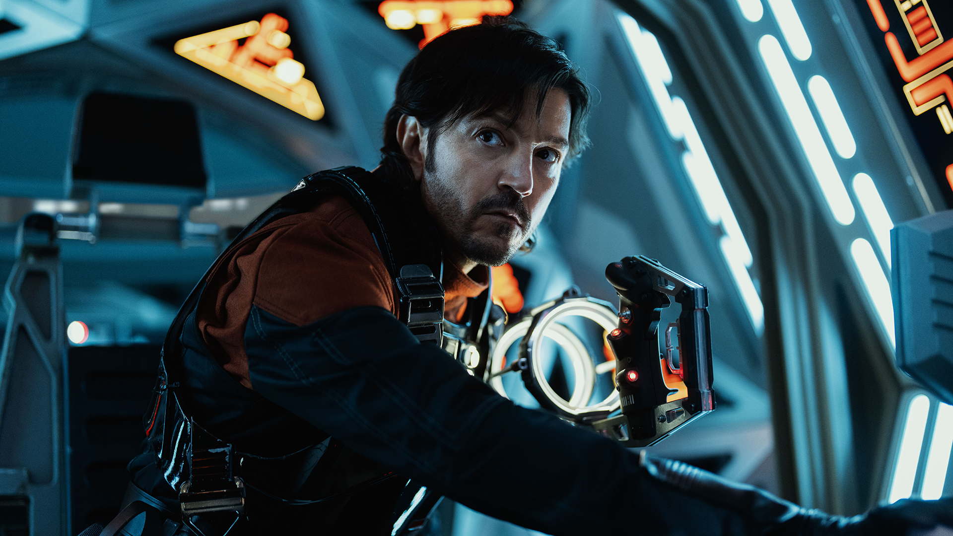 Cassian looks at someone off-camera from a TIE fighter cockpit in Andor Season 2