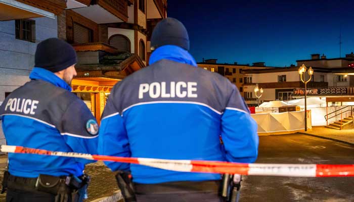 Police control access to the street where a fire tore through a crowded bar during New Year's Eve in the alpine ski resort of Crans-Montana on January 1, 2026. — AFP