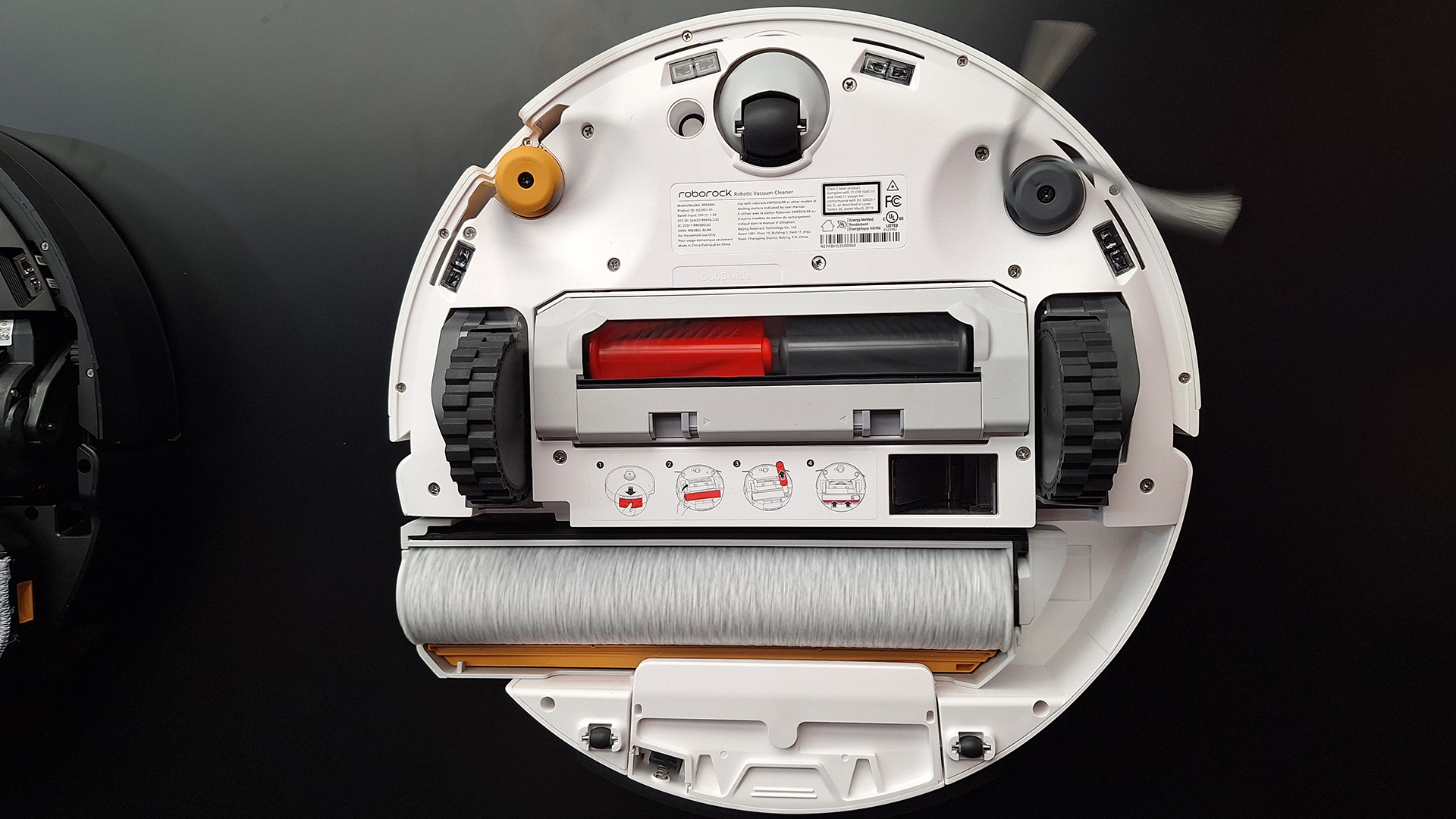 The Roborock Qrevo Curv 2 robot vacuum flipped over to reveal the mopping system underneath