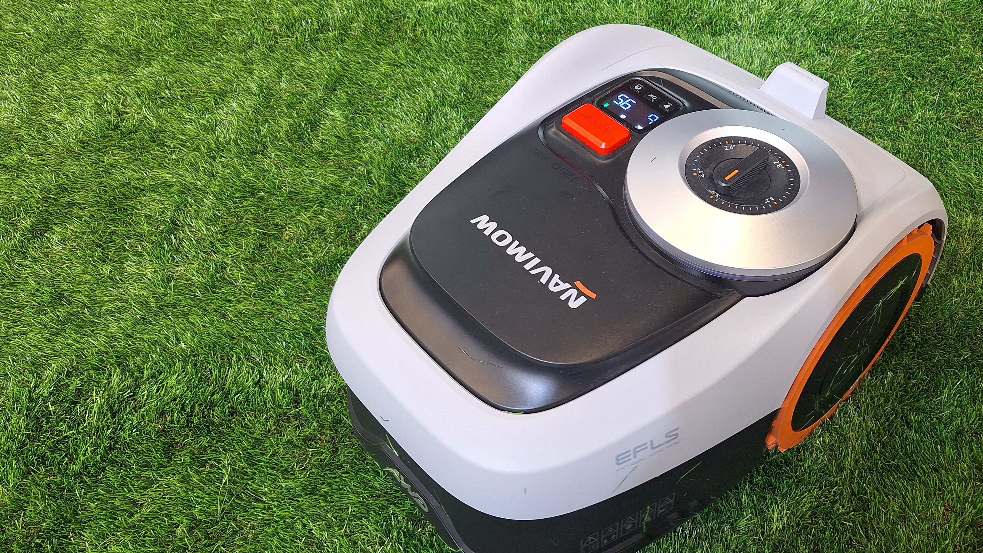 Navimow i2 AWD robotic lawnmower in action on astroturf