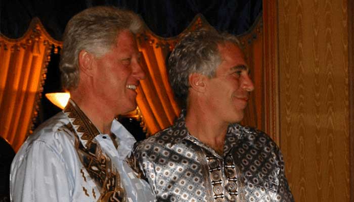 Former U.S. President Bill Clinton stands with Jeffrey Epstein in this photo released by the Department of Justice in Washington, DC, U.S., on Dec. 19, 2025, as part of a new trove of documents from their investigations into the late financier and convicted sex offender Jeffrey Epstein. - Reuters