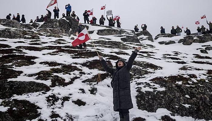 People take part in a protest against U.S. President Donald Trump's demand that the Arctic island be ceded to the United States, calling for it to be allowed to determine its own future, in Nuuk, Greenland on January 17, 2026. — Reuters