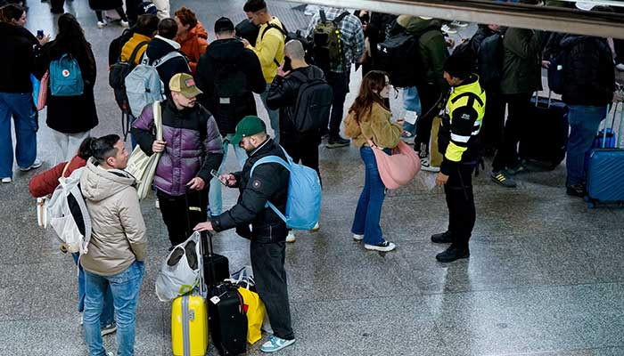 Passengers gather at Atocha train station amid train delays and cancellations after a deadly derailment of two high-speed trains in Adamuz near, Cordoba, according to local police reports in Madrid, Spain, January 18, 2026. — Reuters