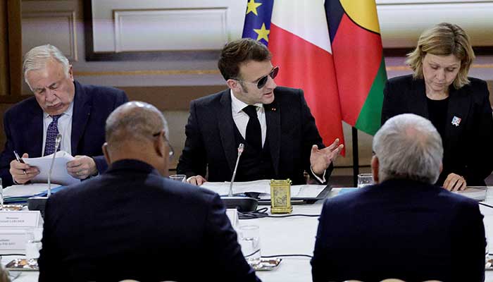 French President Emmanuel Macron, flanked by National Assembly President Yael Braun-Pivet and Senate President Gerard Larcher, gestures as he chairs a meeting on New Caledonia at the Elysee Palace in Paris, France, January 19, 2026. — Reuters