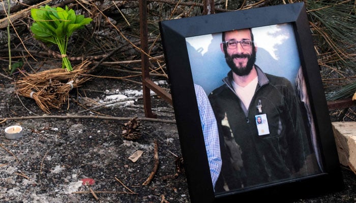 A photograph of 37-year-old Alex Pretti is seen at a makeshift memorial in the area where he was shot and killed by federal immigration agents earlier in the day in Minneapolis, Minnesota, January 24, 2026. — AFP