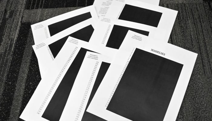 Redacted documents after the US Justice Department began releasing long-awaited records from the investigation into the politically explosive case of convicted sex offender Jeffrey Epstein. — AFP