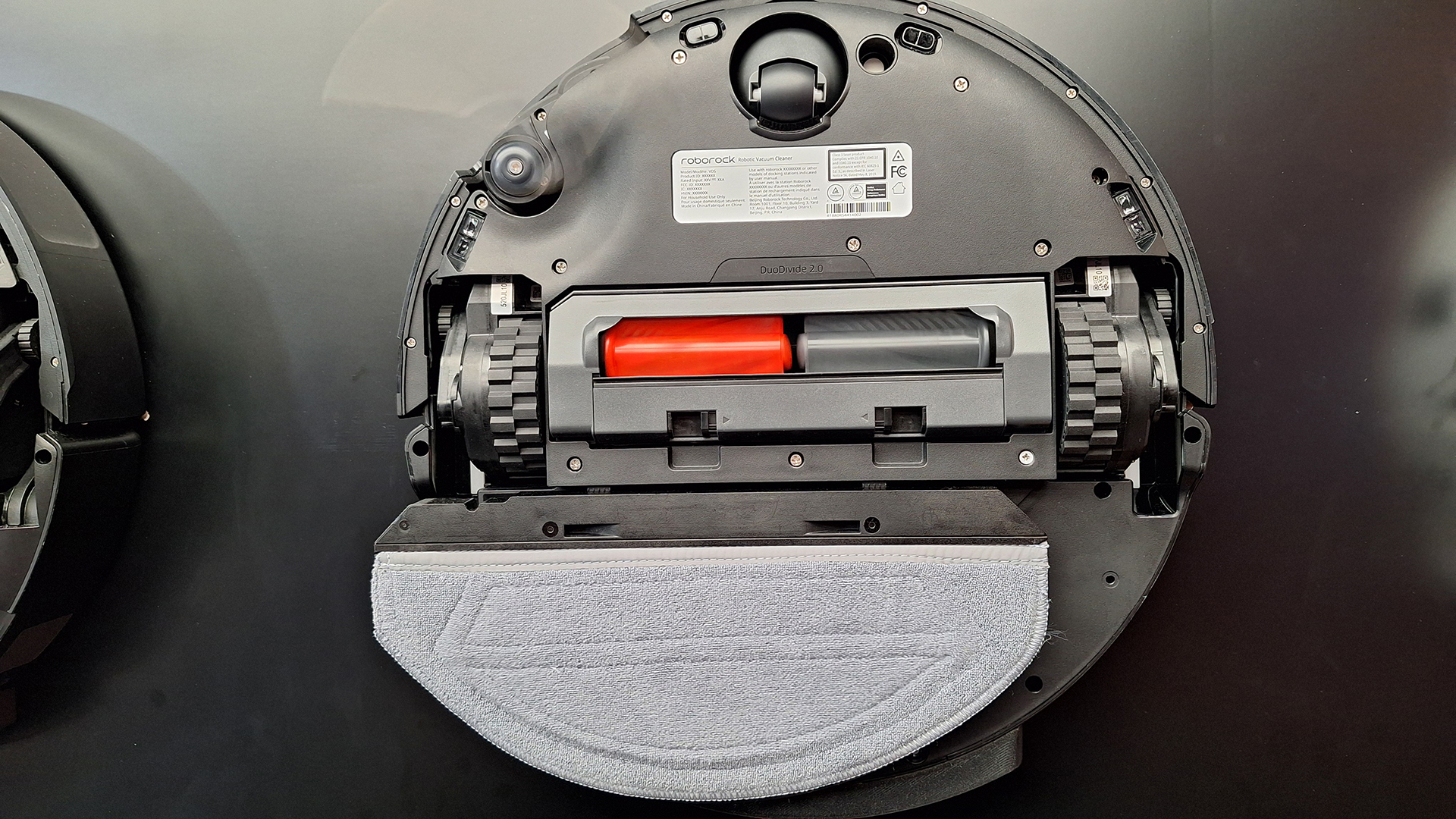 The Roborock Saros 20 Sonic robot vacuum flipped over to reveal the mopping system underneath