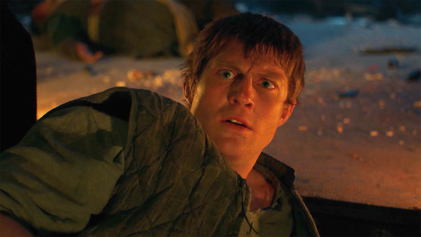 A confused Dunk lying on the ground looking at an egg off camera in A Knight of the Seven Kingdoms episode 3