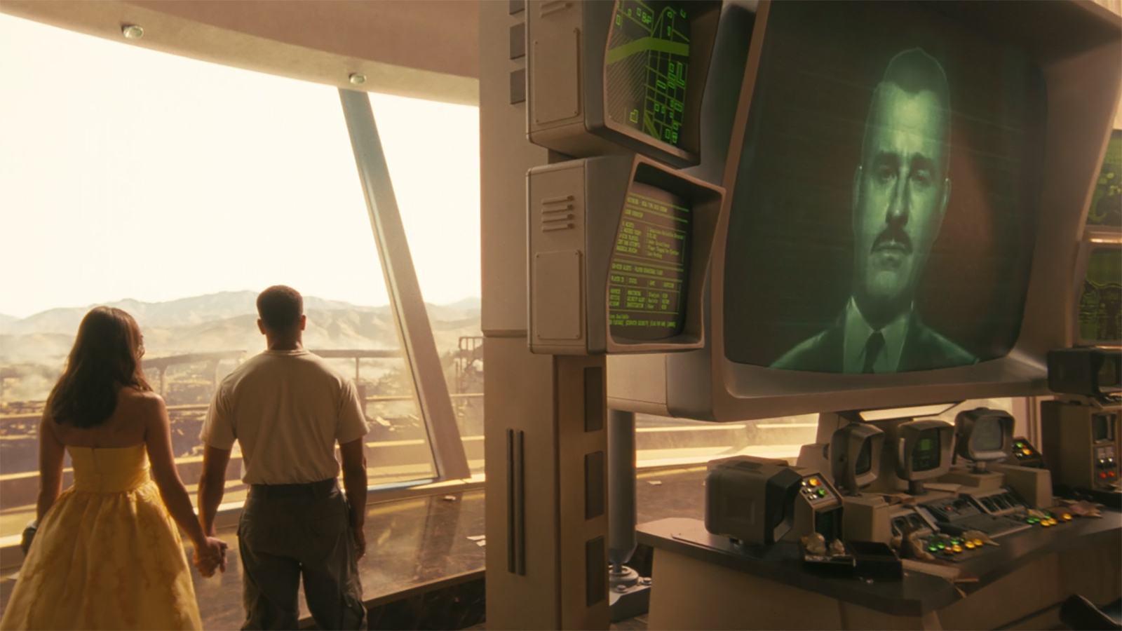 Lucy and Maximus hold hands and look out a window as Robert House appears on a computer screen in Fallout Season 2 Episode 8