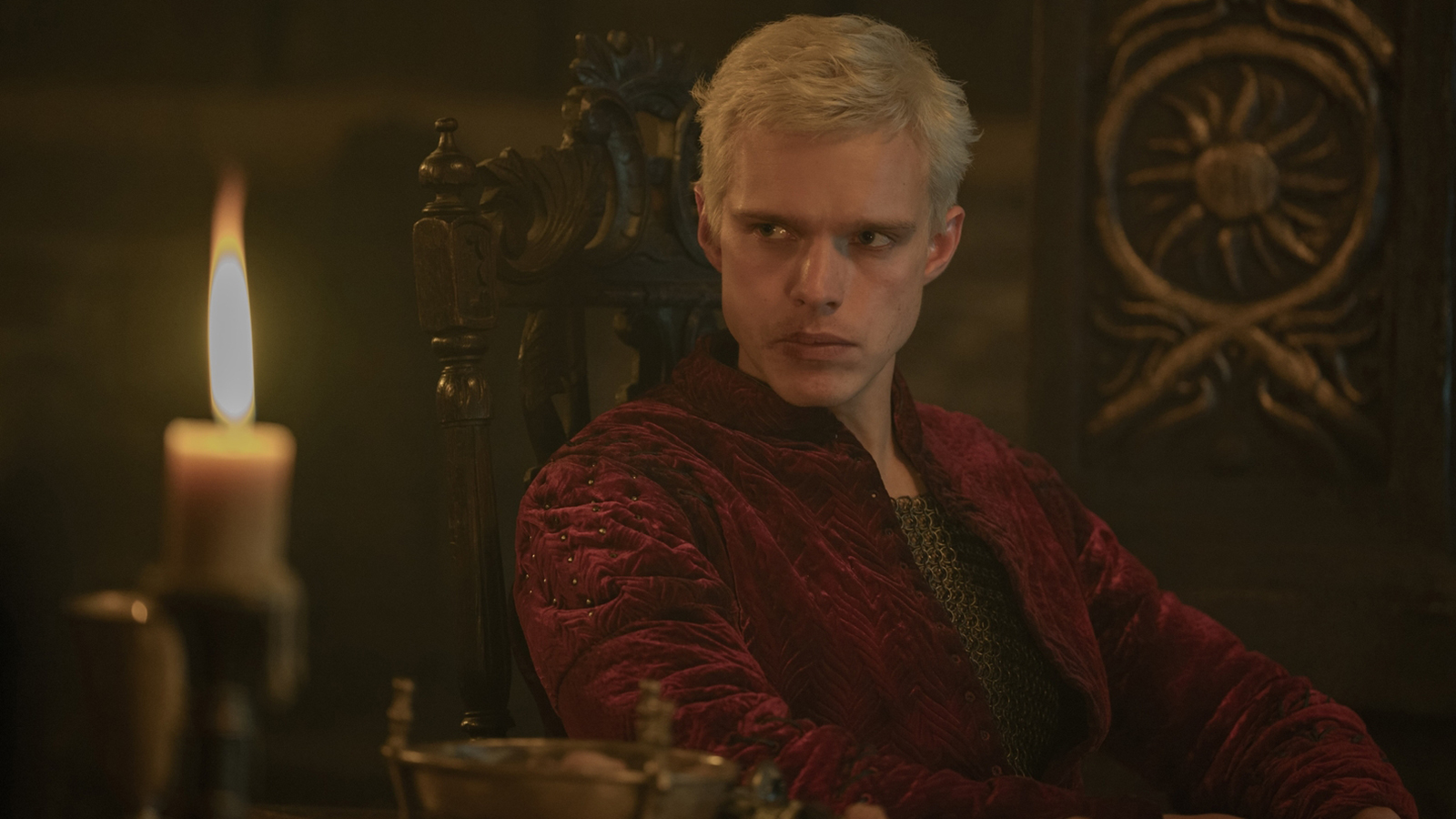 Aerion Targaryen sits down next to a lit candle in A Knight of the Seven Kingdoms episode 4