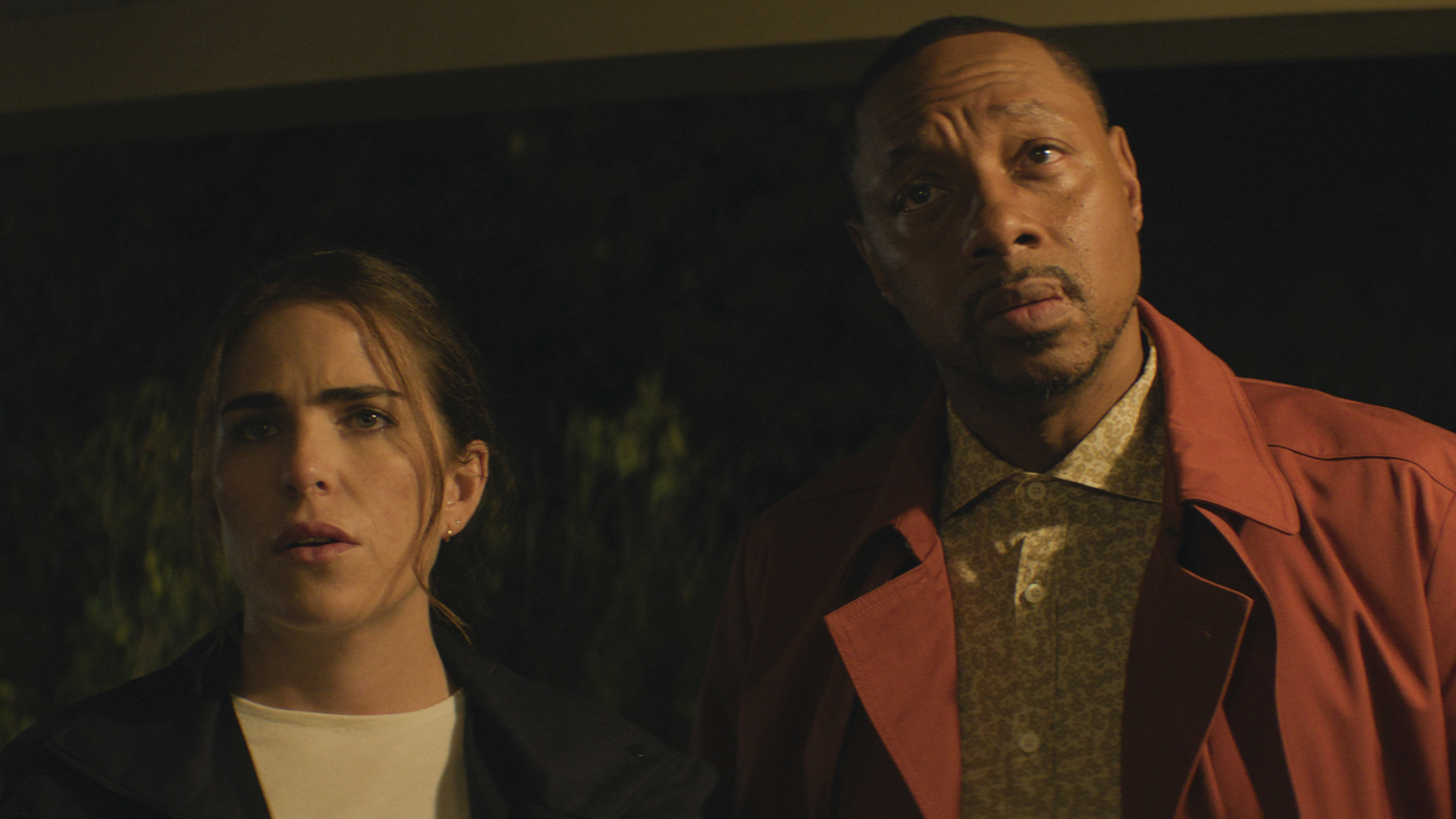 Lee and Karl stare at something off-camera in 56 days