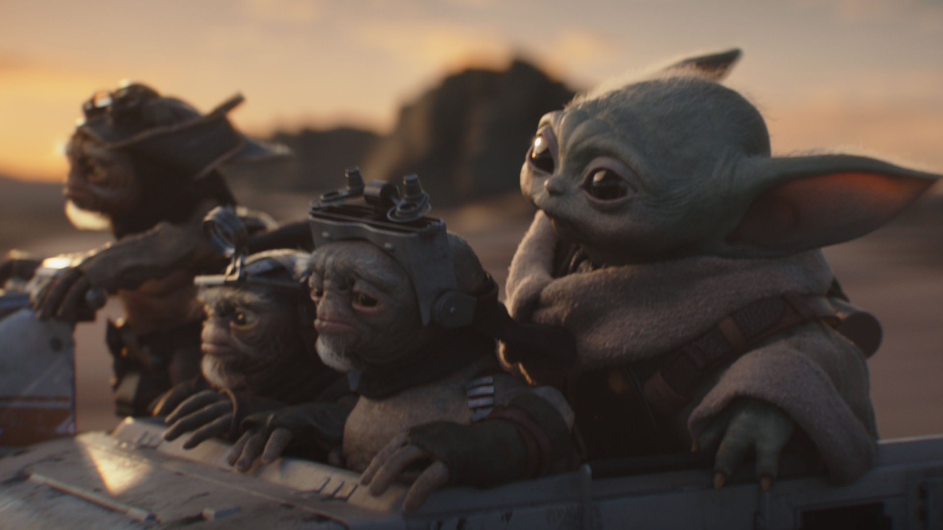 Bai, Clang, Keeto and Baby Yoda ride in a vehicle in The Mandalorian and Grogu