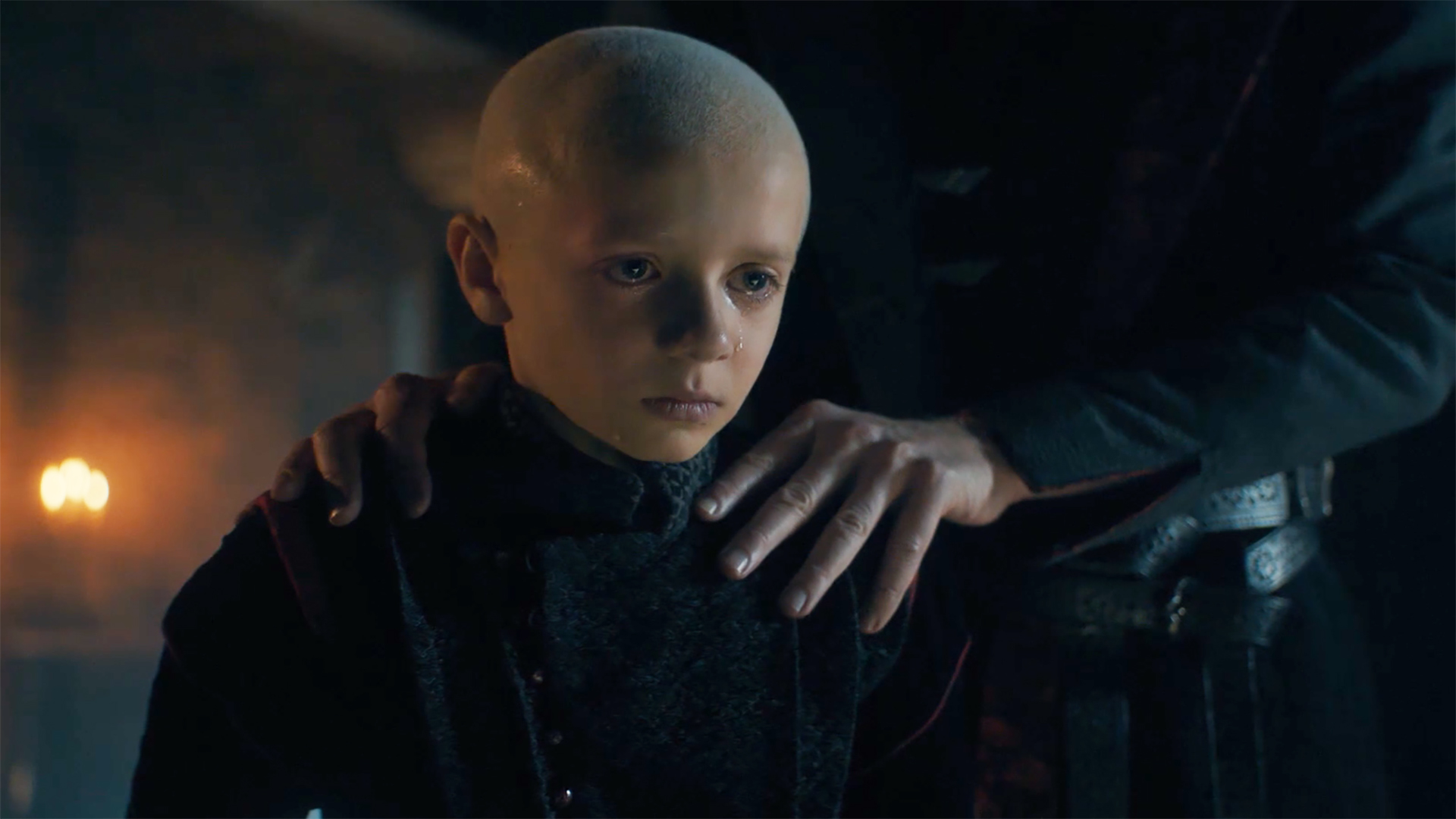 Egg cries as Maekar's hand rests on his left shoulder in A Knight of the Seven Kingdoms episode 6