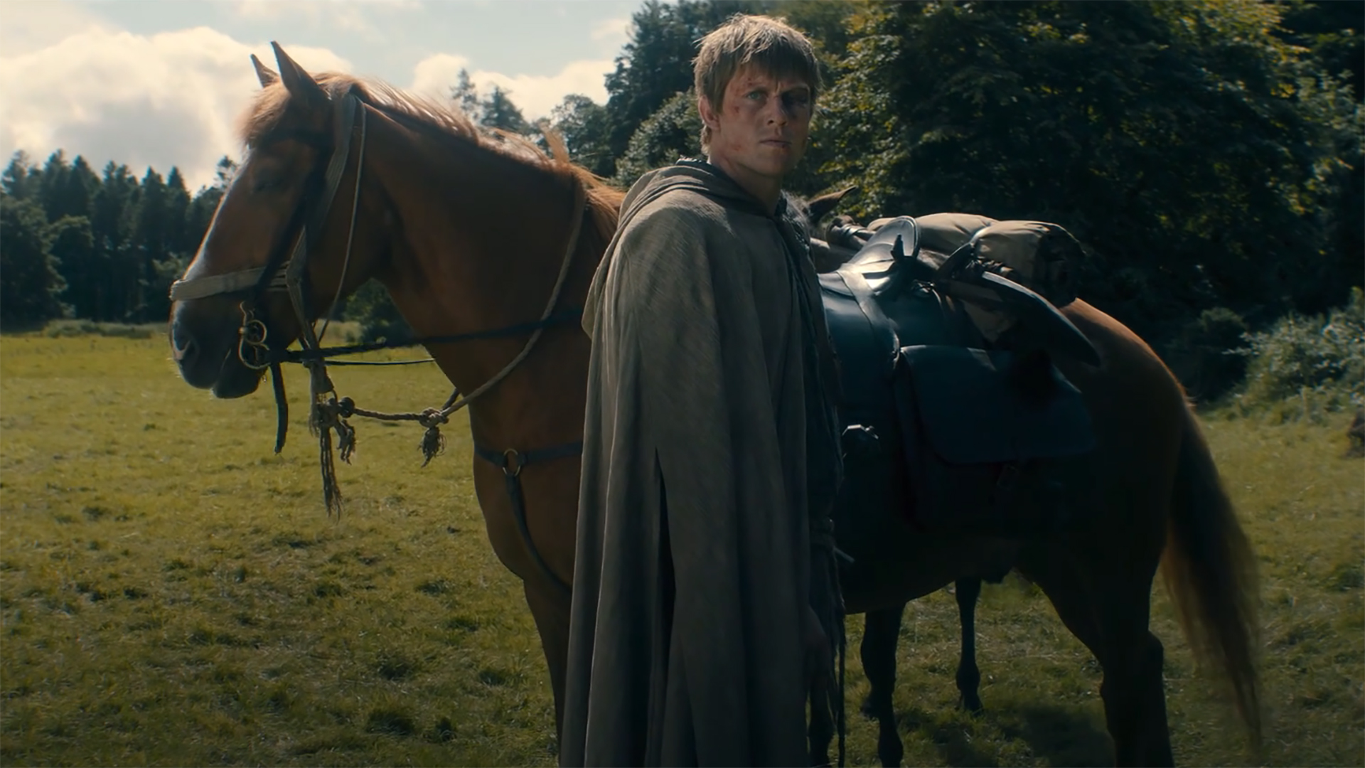 Dunk stands next to Chestnut and looks at an egg off camera in A Knight of the Seven Kingdoms Season 1 Episode 6