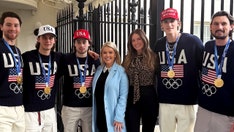 Karoline Leavitt's photo in the White House with Team USA hockey stars ignites online fury over MAGA hat