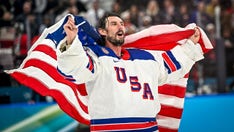 Olympic hero Connor Hellebuyck displays the 'Minister of Defence' plate on the flight to the White House