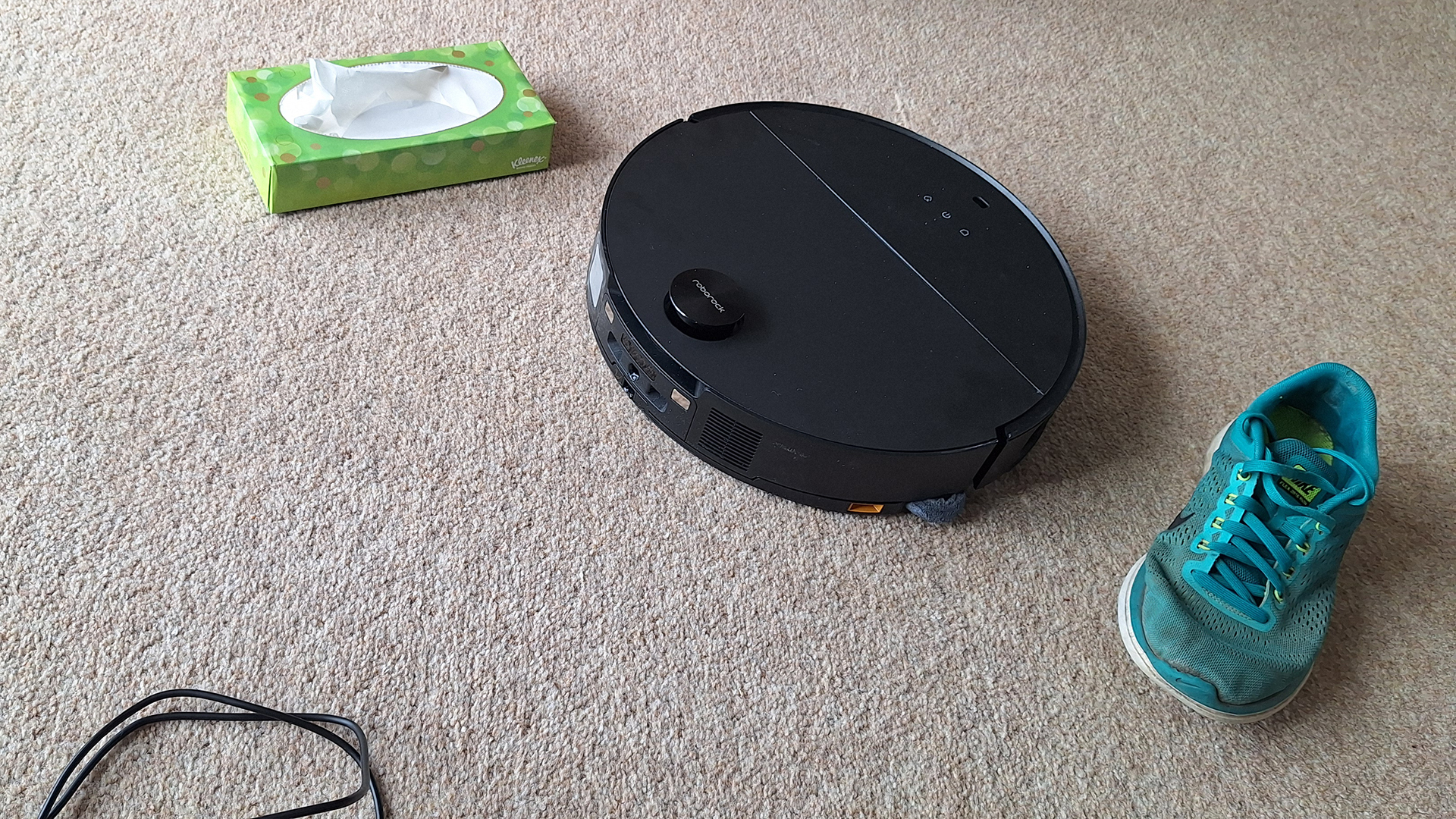 Roborock Saros 10 robot vacuum cleaner avoids a shoe