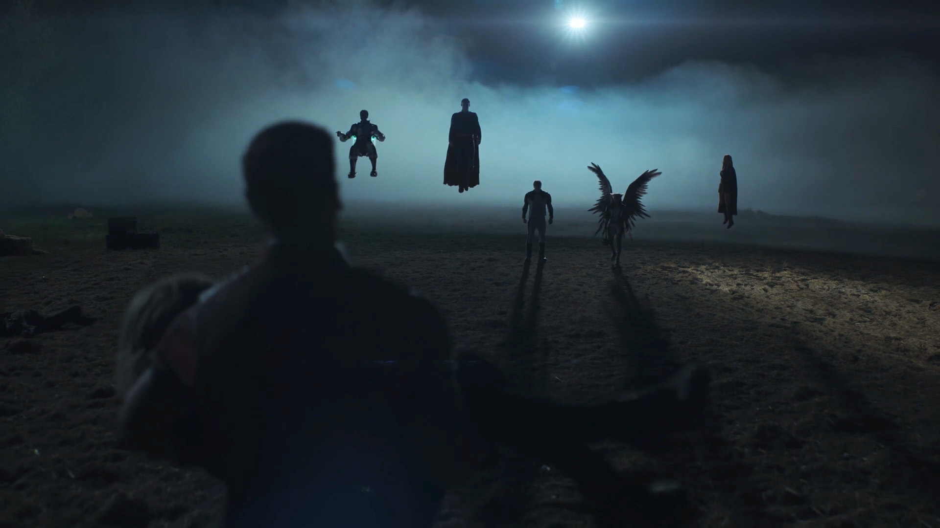 A silhouette shot of the Justice League, Superman and Supergirl at night in Peacemaker Season 2 Episode 1