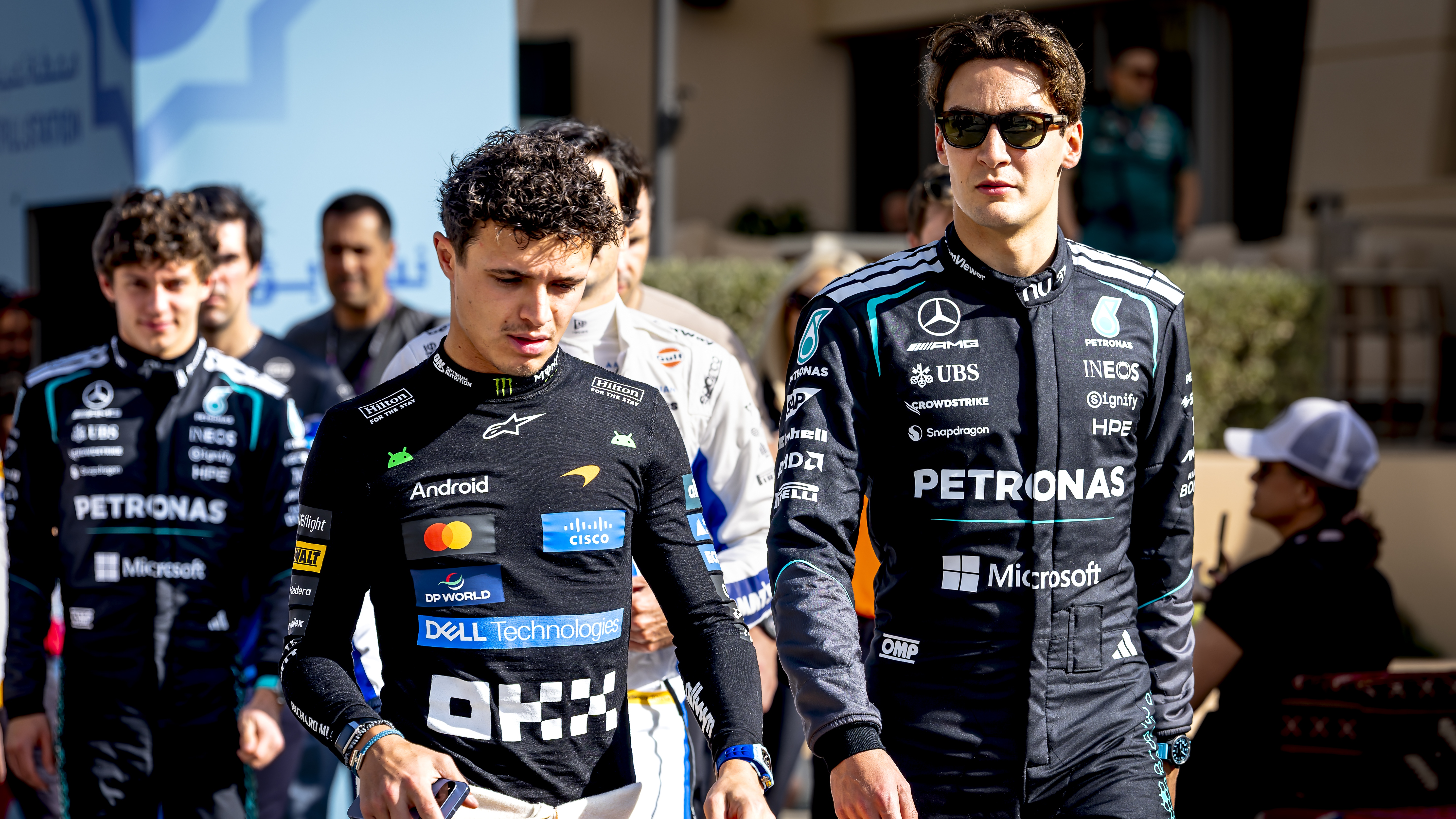 Formula One driver Lando Norris of the McLaren Mastercard Formula One Team and Formula One driver George Russell of the Mercedes AMG-Petronas Formula One Team take part in the Formula One pre-season test at the Bahrain International Circuit for the 2026 season in Sakhir, Bahrain, on February 12, 2026.