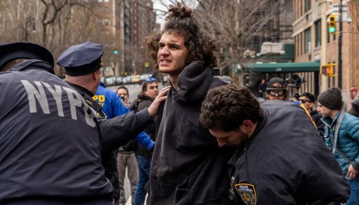 Counter-protester Emir Balat is detained by New York Police Department (NYPD) officers outside Gracie Mansion, the official residence of New York City Mayor Zohran Mamdani, during an anti-Islam protest led by far-right activist Jake Lang in New York City, New York, U.S., March 7, 2026. — Reuters