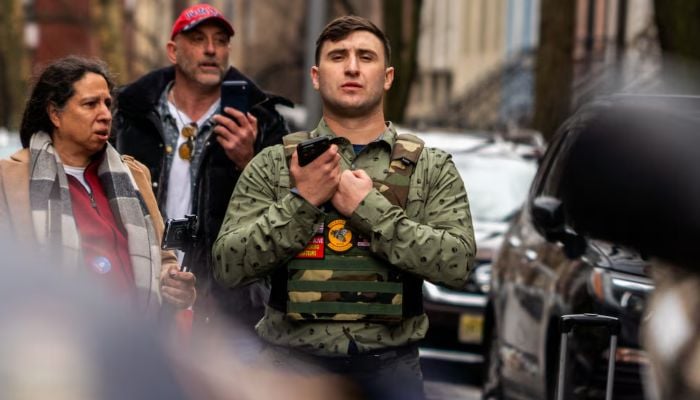 Far-right activist Jake Lang stands outside Gracie Mansion, the official residence of New York City Mayor Zohran Mamdani, during an anti-Islam protest that also drew counter-protesters in New York, New York, U.S., March 7, 2026. — Reuters
