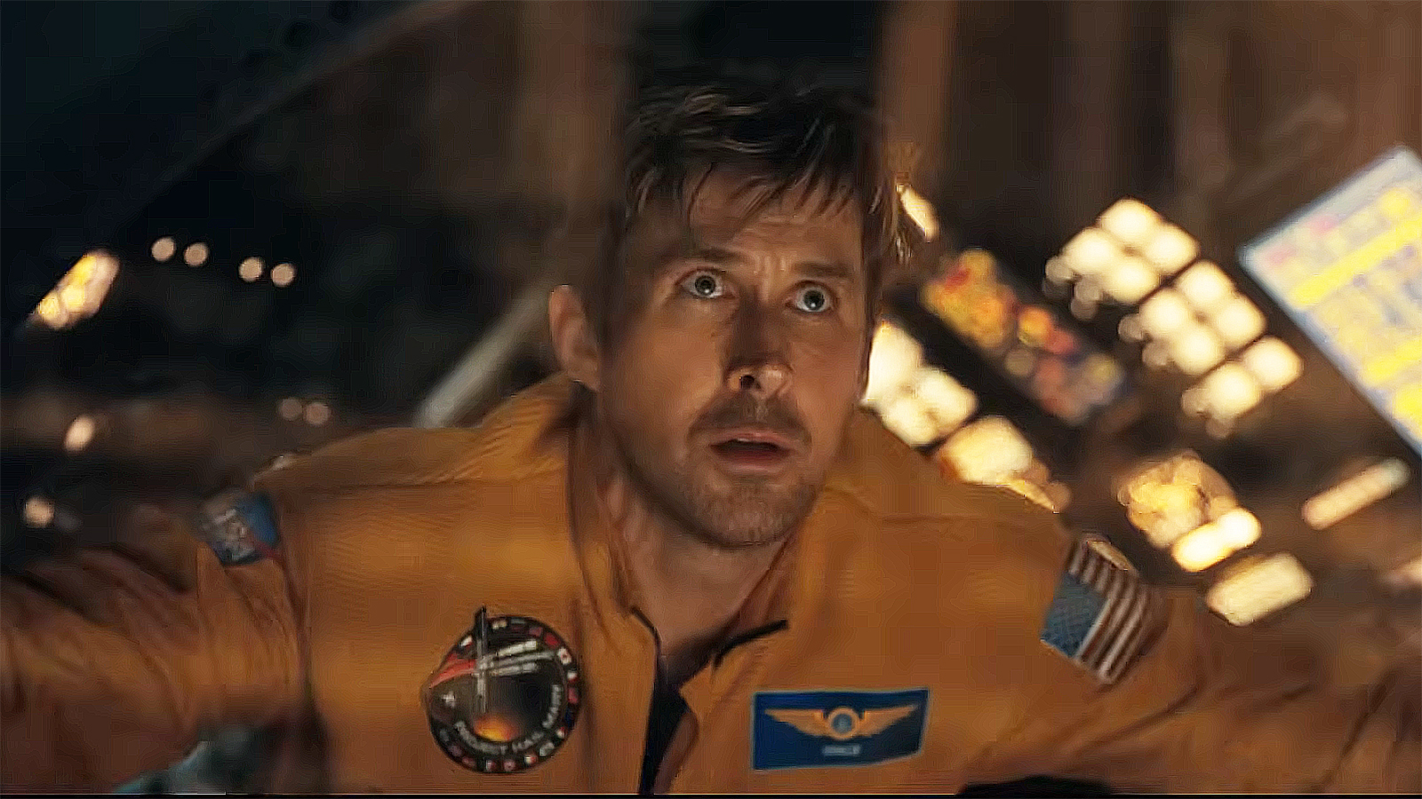 Ryan Gosling's Ryland Grace stares out a spaceship window into space in Project Hail Mary