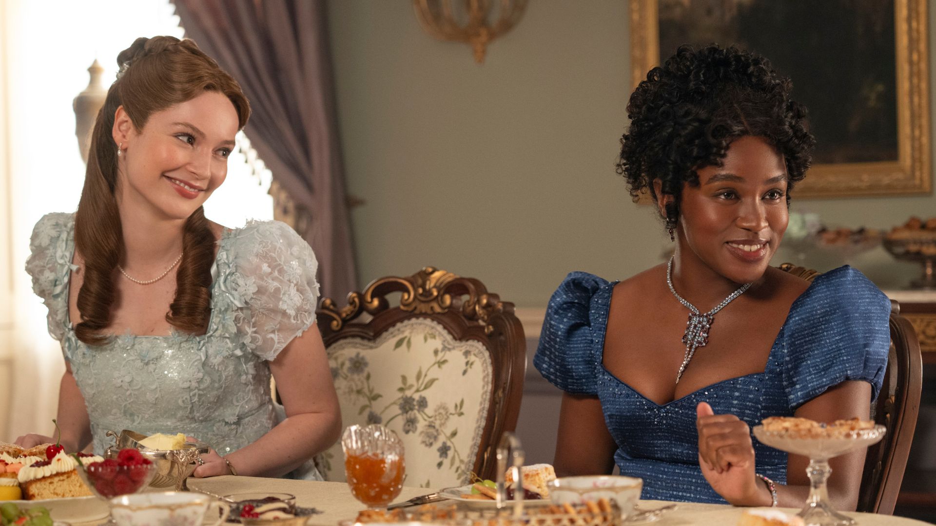 Francesca smiles at Michaela at the dining table