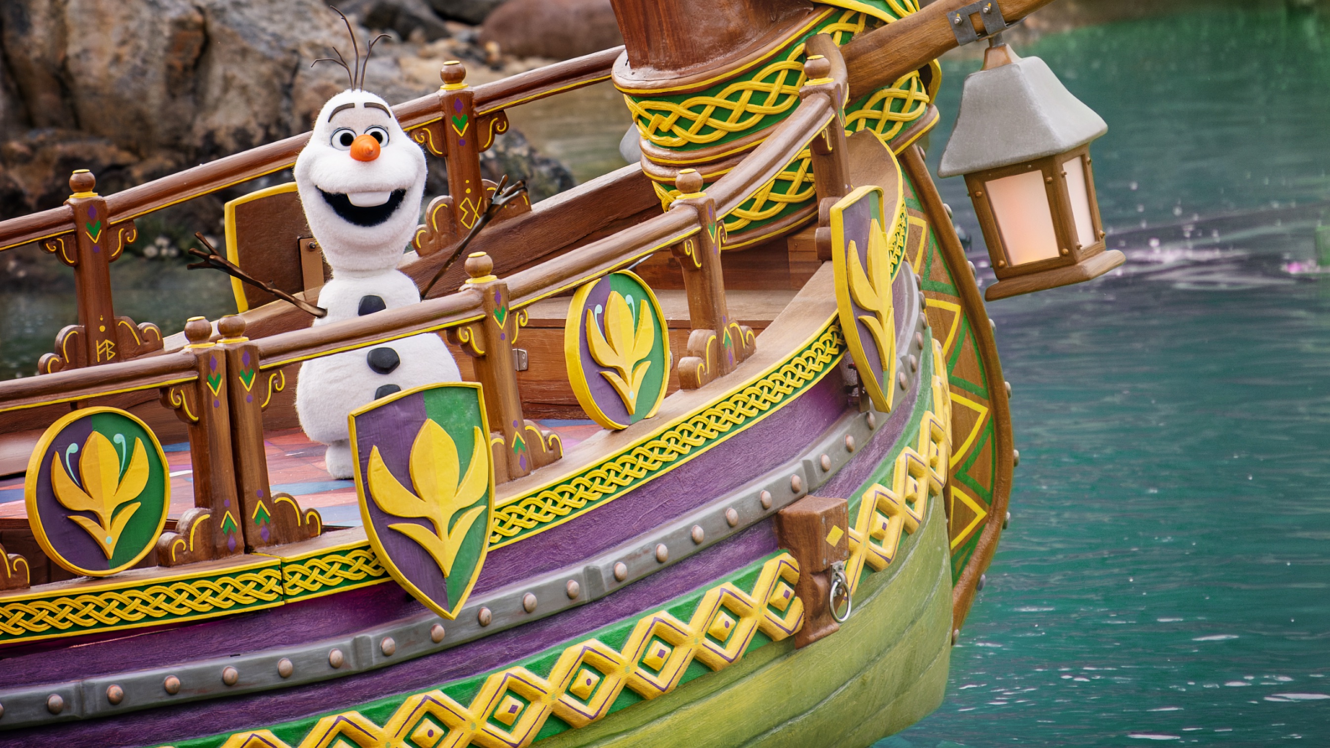 Olaf the next generation robot on a boat in a celebration of Arendelle at Adventure World in Disneyland Pairs