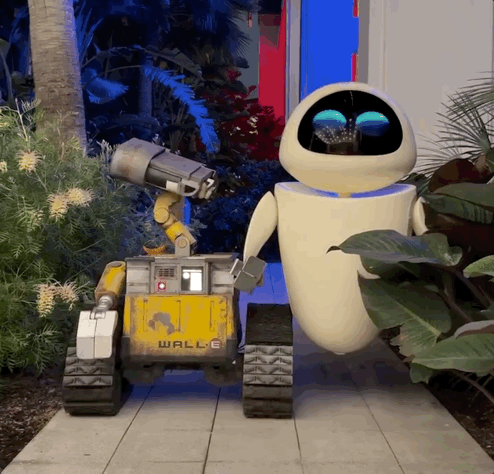 Wall-E and Eve robot figures roaming the Pixar Place Hotel at the Disneyland Resort.