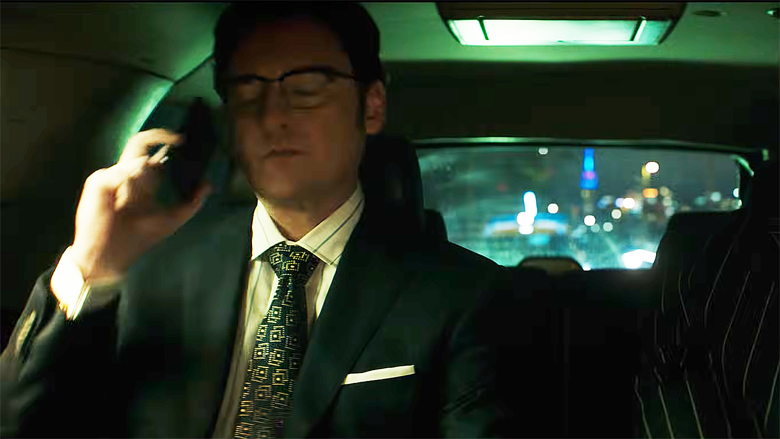 James Wesley sits in a car and holds a cell phone to his right ear in Daredevil: Born Again Season 2 Episode 5
