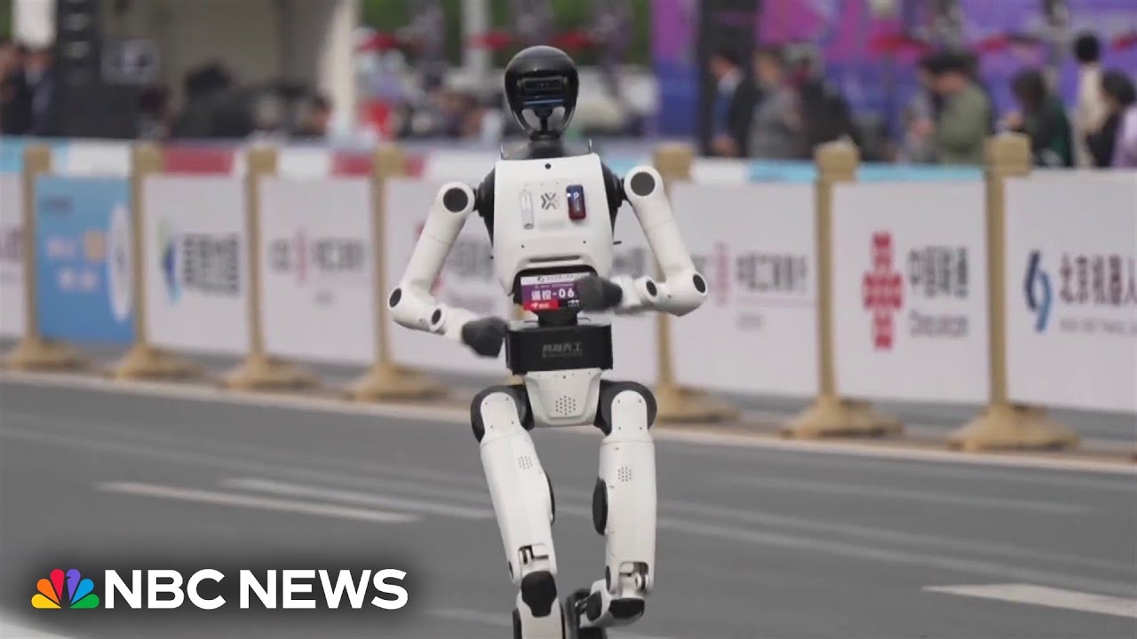 Humanoid robots run in Beijing half marathon - YouTube