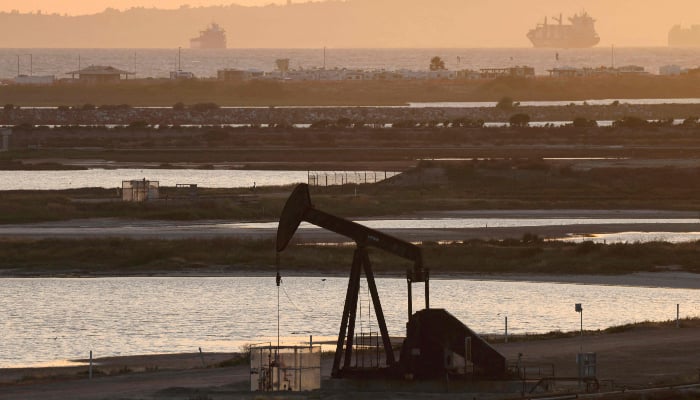 A pump jack stands idle in the Huntington Beach oil field on April 23, 2026 in Huntington Beach, California, United States. — AFP