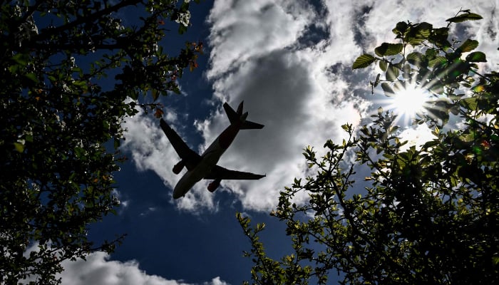 An airliner prepares to land at London Gatwick Airport, near Crawley, southern England, on April 20, 2026. — AFP