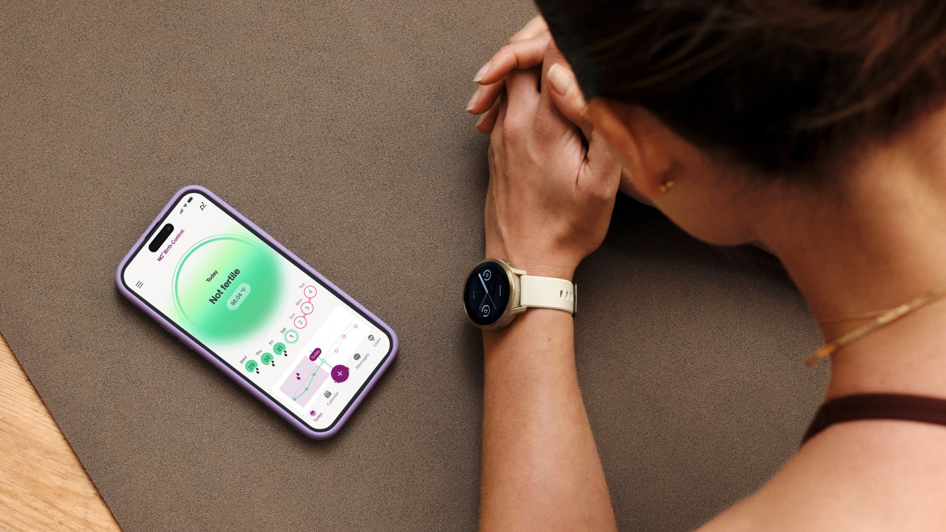 An iPhone and Garmin smartwatch that displays a person's bike tracking information.