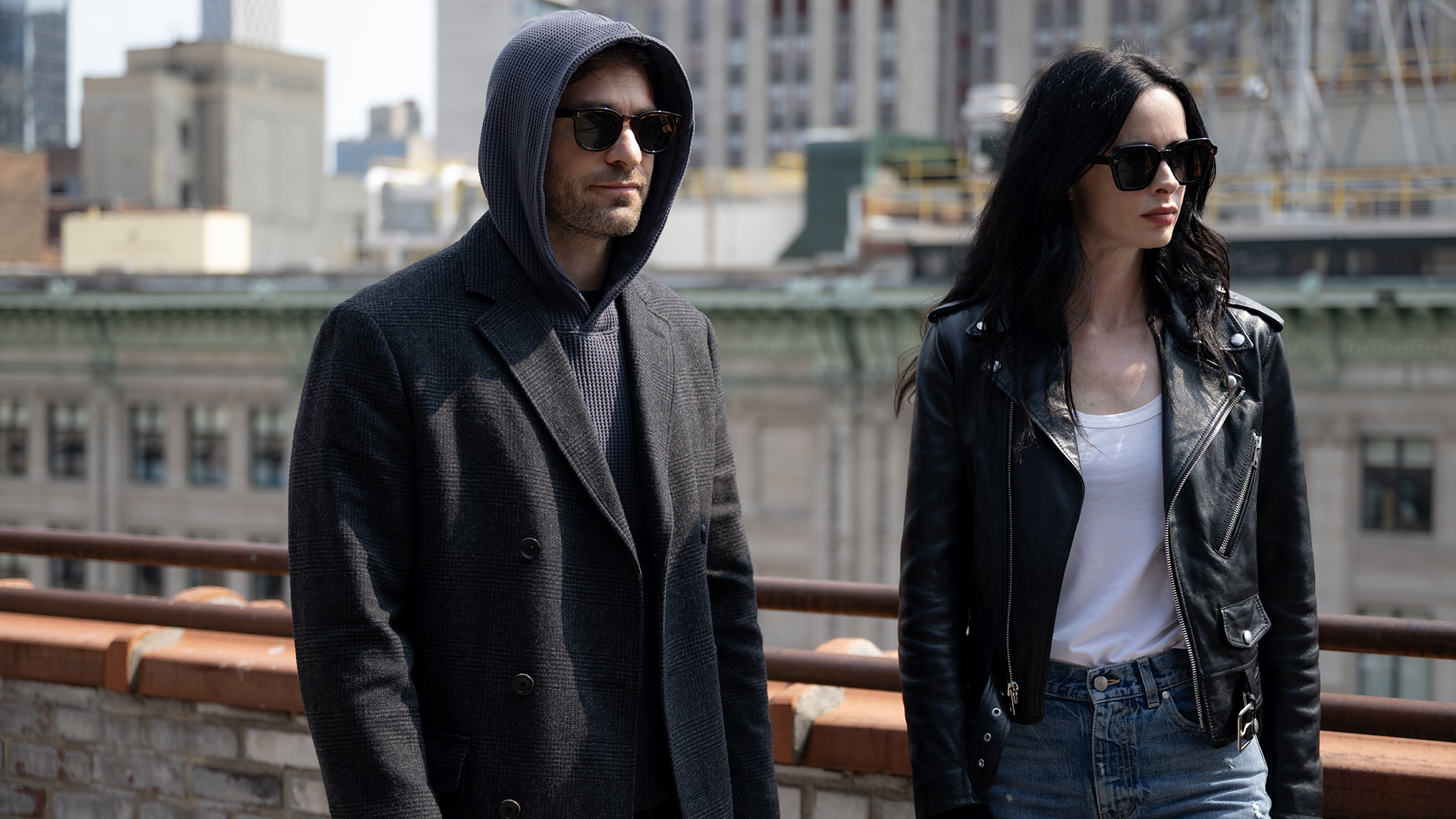 A hooded Matt wearing sunglasses standing next to a sunglasses-wearing Jessica Jones in Daredevil: Born Again Season 2 Episode 7
