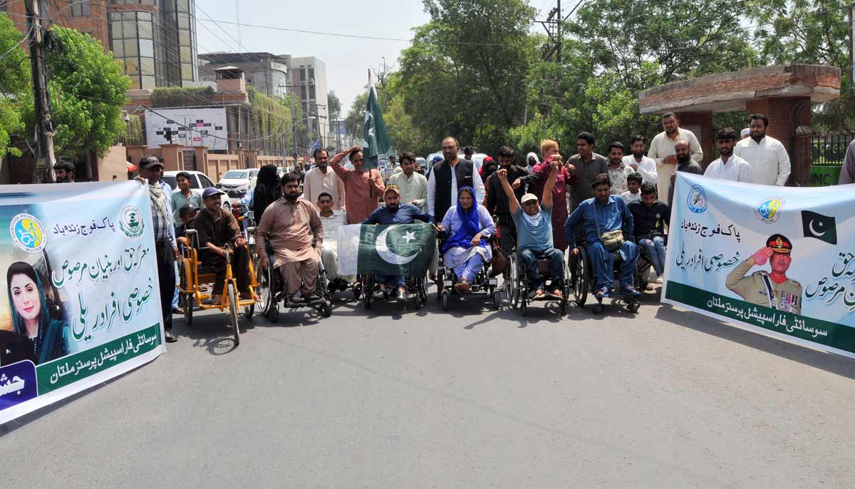 People with disabilities under the banner of the Society for Persons with Disabilities participate in a rally to celebrate Marka-e-Haq and express solidarity with the Pakistan Armed Forces in Multan. - APP