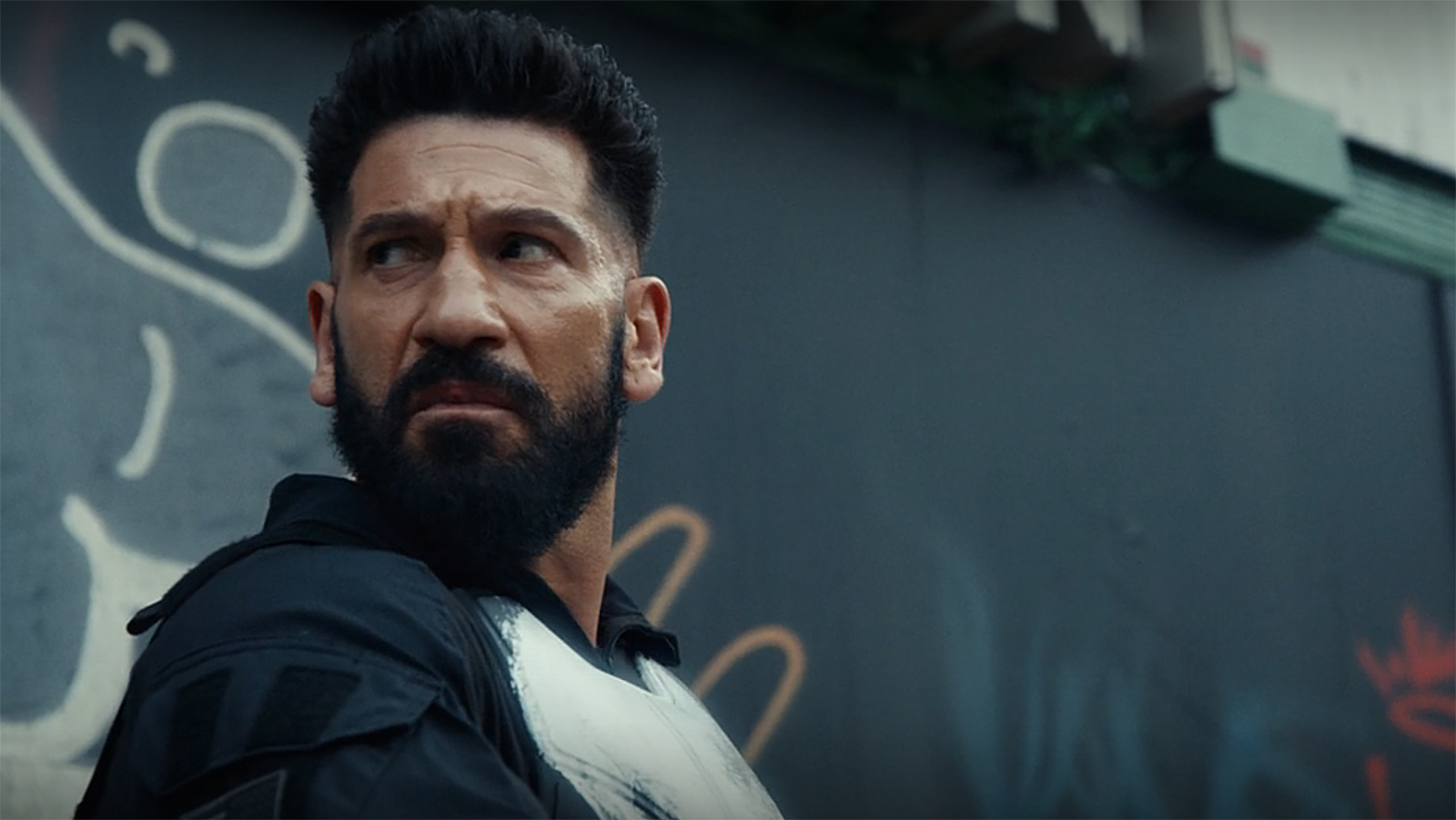 Frank Castle looks back at someone off-camera in The Punisher: One Last Kill
