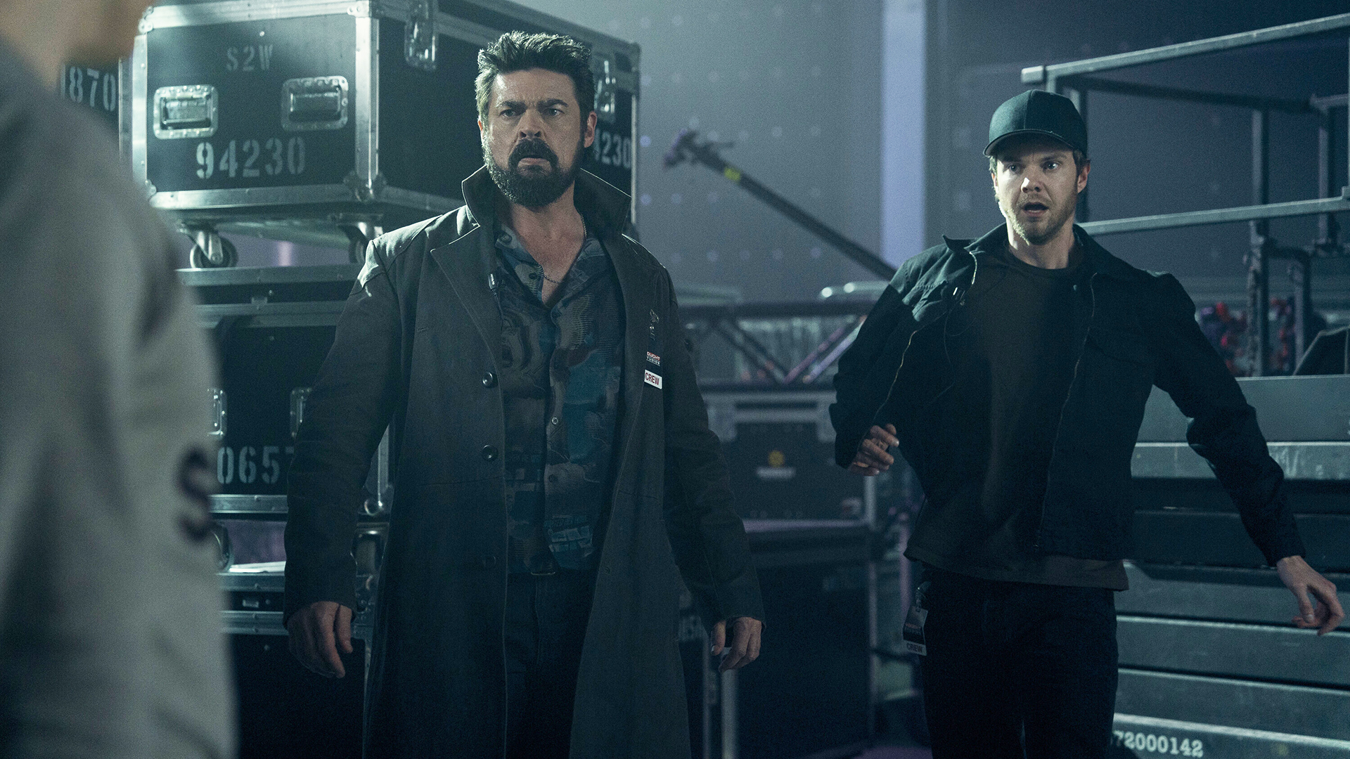 Billy and Hughie look shocked at someone off camera in The Boys Season 5 Episode 7