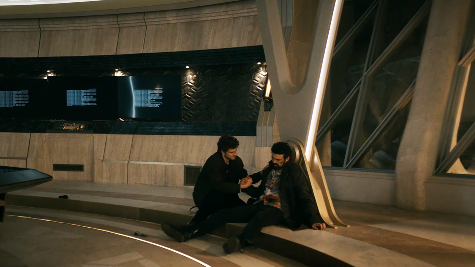 A wide shot of Hughie holding a dead butcher's hand in Vought Tower in The Boys season 5 finale