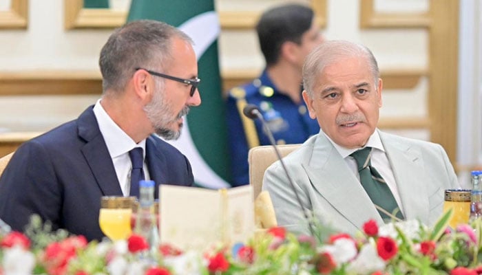 Prince Rahim Aga Khan V speaks with Shehbaz Sharif during a breakfast meeting at the Prime Minister's House in Islamabad on May 21, 2026. — PID