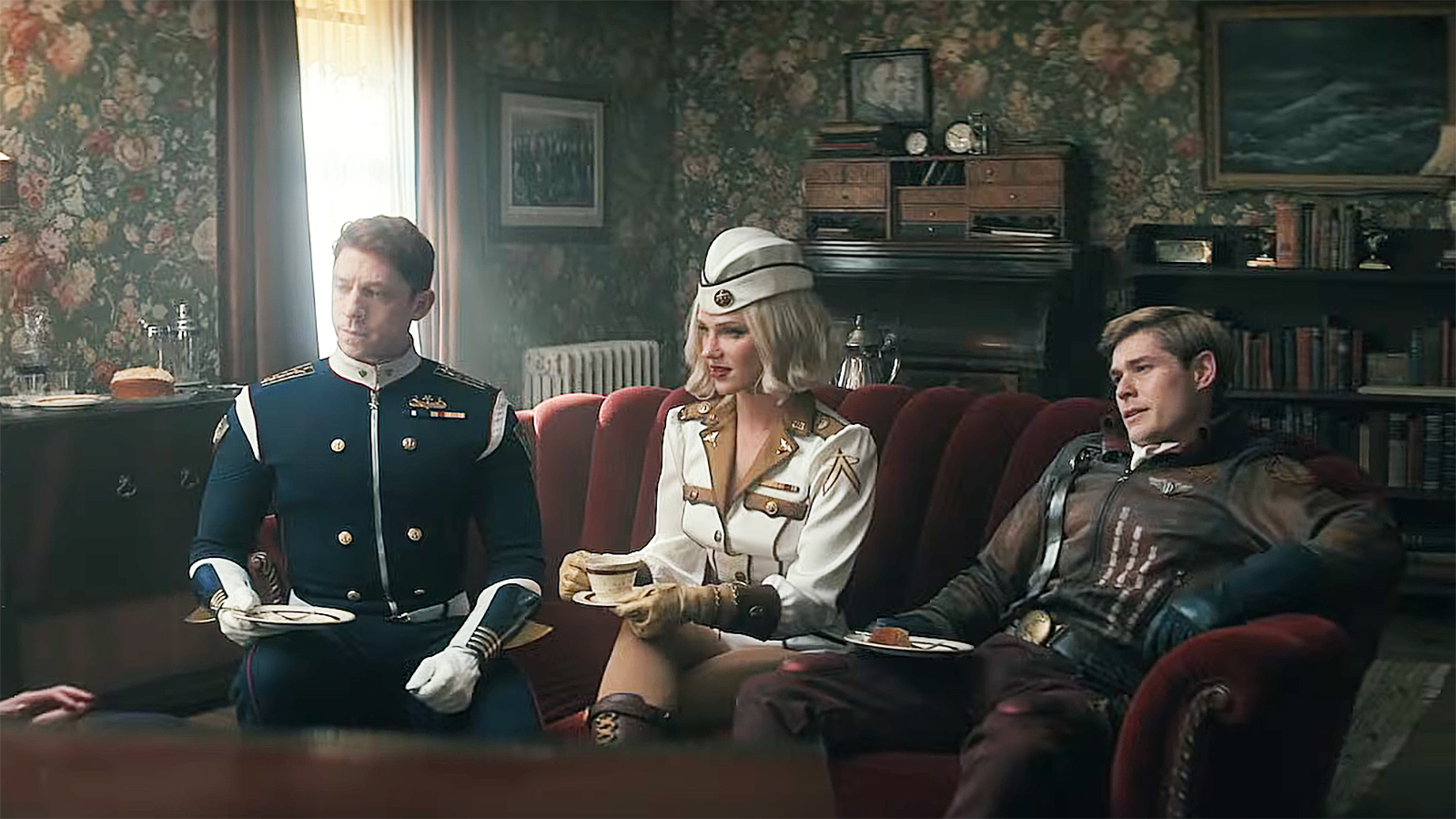 Torpedo, Private Angel and Bombsight are sitting on a couch in Vought Rising